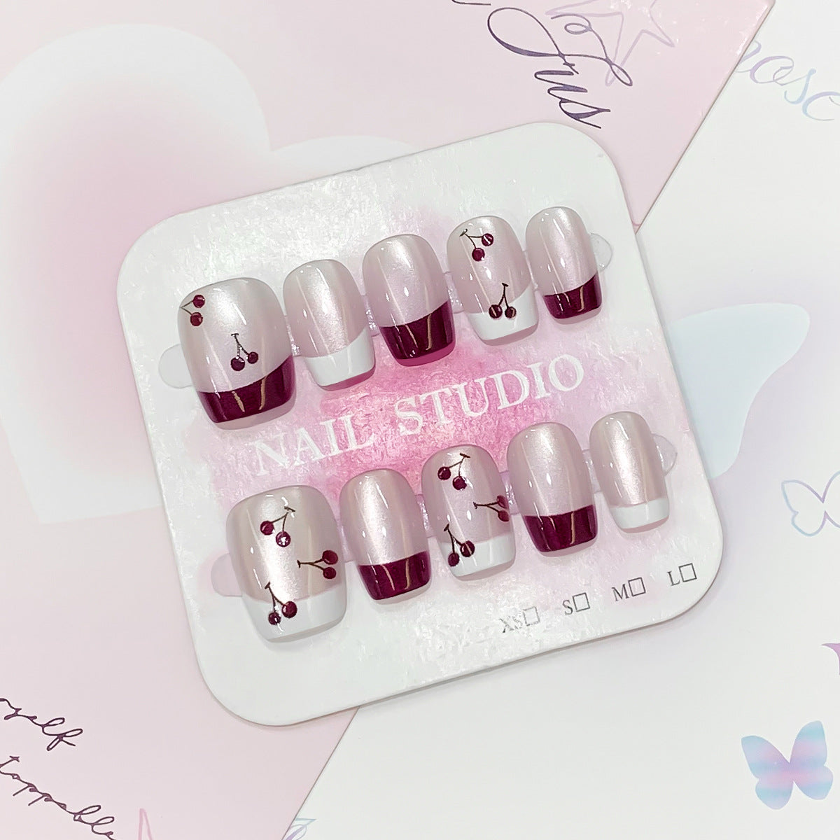 Kunstvolle Nagelspitzen mit Kirsch-Design Brehn