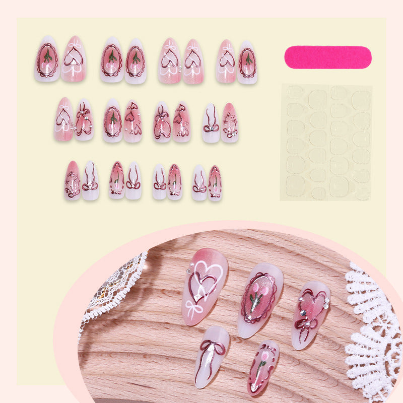 Kunstnagelset mit romantischen Herzen und Schleifen-Design Brehn