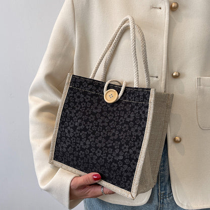 Elegante floral gemusterte Handtasche