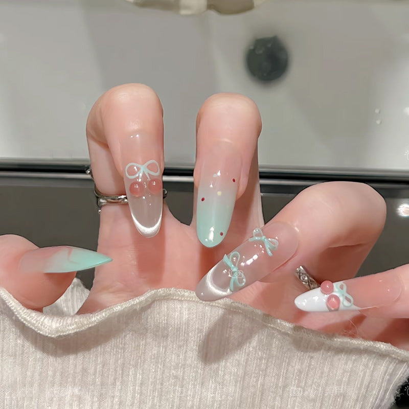Kunstnagelset mit eleganten Schleifen- und Kirschen-Designs Brehn