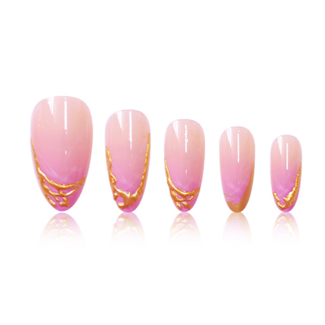 Elegante Stiletto Press-On Nagelerweiterungen mit goldenen Spitzenakzenten Brehn