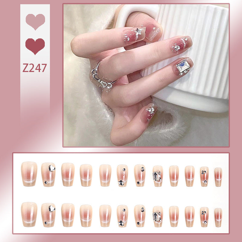 Kunstnagelset mit eleganten Glitzer- und Sternverzierungen Brehn