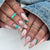 Künstlerisches Press-On-Nagelset mit stilvollen Blumen- und Edelstein-Designs Brehn