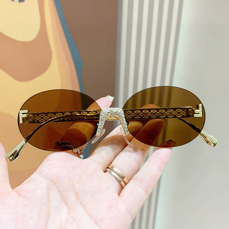 Damen Sonnenbrille mit glitzerndem Rahmen und ovalen Gläsern Brehn