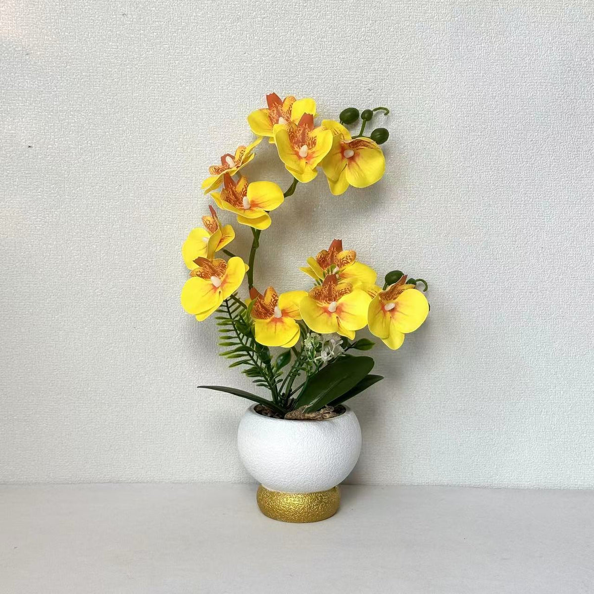 Künstliche Orchideenarrangement für Tischdekoration