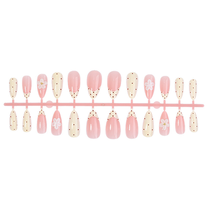 Elegantes Press-On Nail Set mit floralen und gepunkteten Designs Brehn