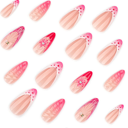 Kunstvolle Stiletto-Nägel mit floralem Design und Glitzerakzenten Brehn