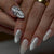 Elegante Stiletto Nagelkunstverlängerungen mit silbernen Akzenten Brehn