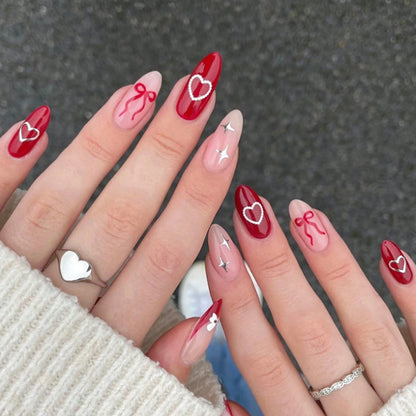Kunstnagelset mit romantischen Herzen und Schleifen Brehn