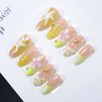 Kunstnagelset mit maritimen Muschel- und Blütenmotiven Brehn