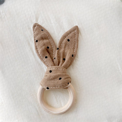 Beißring aus Holz und Baumwollstoff