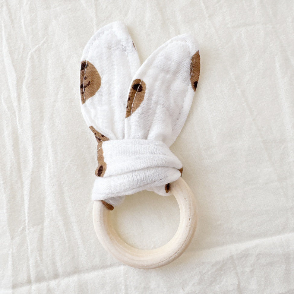 Beißring aus Holz und Baumwollstoff
