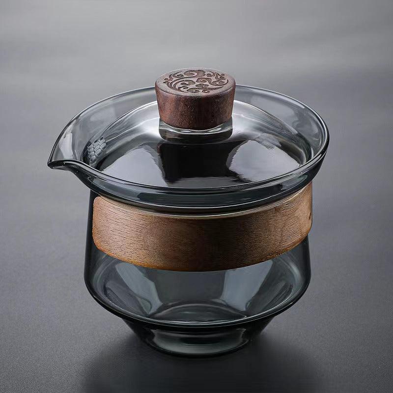 Elegante hitzebeständige Glastasse mit Walnussdeckel für Teeliebhaber