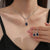 Brehn | Schimmernde blaue Tropfen-Diamant-Halskette und Ohrringe Set